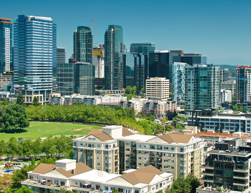 a view of a city with tall buildings in the background