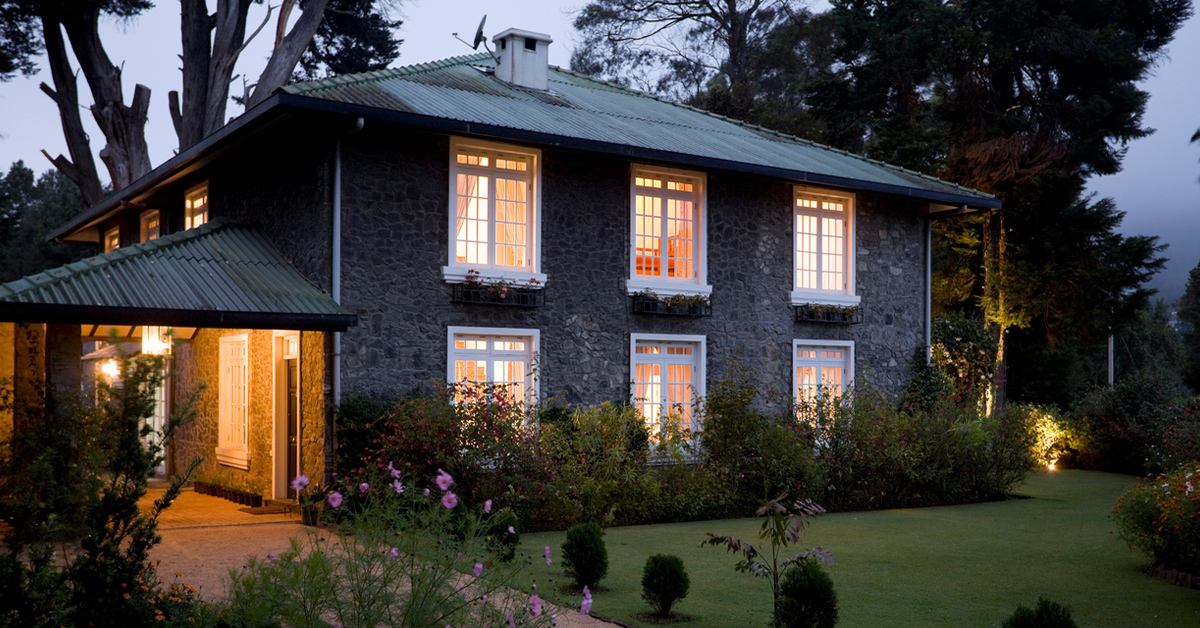 a house with trees in the background