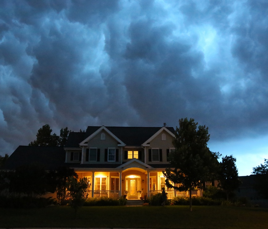 a house with a cloudy sky