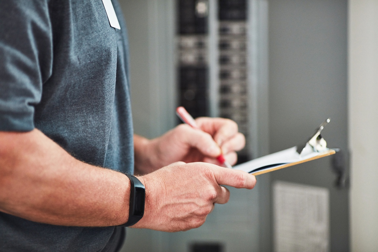 electrician professional completing estimate for electrical services